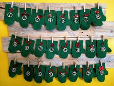 christmas stockings hung on clothes pegs with red and green decorations hanging from the clothesline