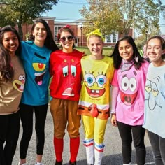 a group of young women standing next to each other