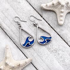 Immerse yourself in coastal creativity with our Creative and Charming Curling Wave Earrings—an exquisite accessory that brilliantly captures the sensations and spirited essence of the beach. More than just earrings, they are wearable art designed to evoke the rhythmic beauty of the ocean waves. Elevate your style effortlessly with these unique and charming earrings, perfect for completing any beach-inspired look with a touch of elegance. Unleash the magic of the seaside around your ears, making Silver Ocean-inspired Earrings For Gifts, Silver Teardrop Earrings For Beach, Ocean-inspired Sterling Silver Beach Jewelry, Silver Ocean-inspired Earrings, Teardrop Ear Wire Jewelry For Beach, Beach Teardrop Jewelry With Ear Wire, Summer Teardrop Jewelry With Matching Earrings, Ocean-inspired Jewelry For Summer, Summer Ocean-inspired Jewelry In Ocean Color