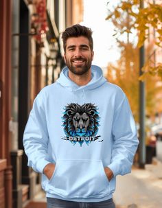 Stay warm and represent your team in style with our Lions Football Hoodie! This Detroit hoodie is perfect for game days, tailgates, or any time you want to show off your Lions pride. Featuring a classic design and soft, durable fabric, this Detroit sweatshirt is the ultimate way to support your team while staying comfortable. WELCOME TO RILEY GIRL DESIGNS *This is a unisex hooded sweatshirt *Material:  50% cotton and 50% polyester for that cozy feel and warmth you need in a hoodie. *Weight:  (8. Detroit Lions Shirt, Lions Pride, Lions Football, Lion Pride, Detroit Lions, Football Shirt, Hooded Sweatshirt, Stay Warm, Classic Design