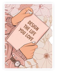 a person holding a book with the words design the life you love written on it