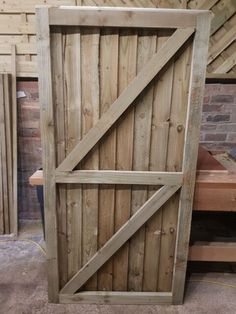 a wooden door sitting in the middle of a room