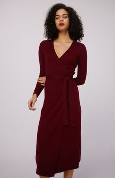 This quintessential wrap sweater-dress knit from luxe wool and cashmere features a sultry dipped neckline and waist-cinching sash. Surplice V-neck Long sleeves 70% wool, 30% cashmere Dry clean Imported Elegant Fitted V-neck Cardigan, Fitted Cashmere V-neck Cardigan, Fitted V-neck Cashmere Cardigan, Fitted Wool V-neck Dress, Formal Fitted Cashmere Cardigan, Fall Fitted Wrap Dress With Surplice Neckline, Winter Cashmere Midi Dress, Elegant Cashmere Sweater Dress For Work, Elegant Fitted Cashmere Cardigan