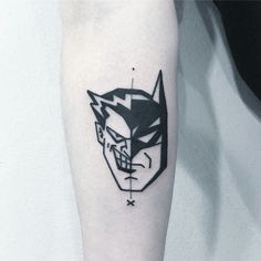 a batman tattoo on the left forearm