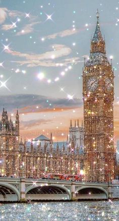 the big ben clock tower towering over the city of london with bubbles floating in the air