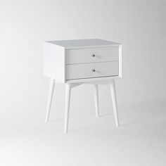 a small white table with two drawers on one side and an open drawer on the other