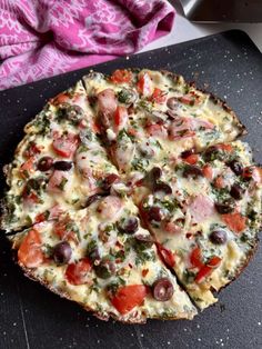 a pizza sitting on top of a cutting board