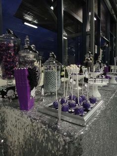 a table with purple and white decorations on it