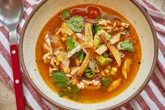 a bowl of soup with chicken and vegetables