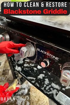 someone is cleaning the side of a grill with soap and water on it, while another person in red gloves stands nearby