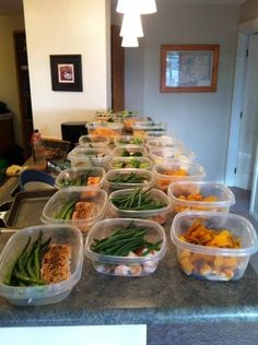 plastic containers filled with food sitting on top of a counter