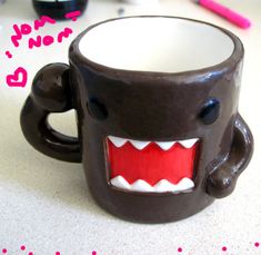 a coffee mug with an angry face on it