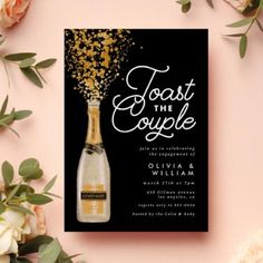 a bottle of champagne and some flowers on a pink background with the words toast the couple