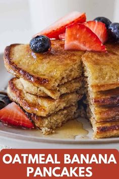 a stack of oatmeal banana pancakes with berries on top