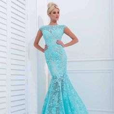 Make A Splash At Your Next Event With The Tony Bowls Tbe11405 Dress In A Striking Aqua Shade, Size 16. This Breathtaking Gown Is Designed To Captivate, Featuring A Form-Fitting Silhouette That Beautifully Accentuates Your Curves While Providing A Flattering Fit. The Dress Is Adorned With Exquisite Embellishments That Catch The Light With Every Movement, Adding A Touch Of Glamour And Sophistication. The Elegant Train Adds A Dramatic Flair, Ensuring You Make A Grand Entrance. Perfect For Weddings, Blue Lace Dresses With Fitted Bodice, Fitted Light Blue Gown, Fitted Light Blue Maxi Gown, Fitted Light Blue Maxi Length Gown, Light Blue Fitted Gown, Blue Short Sleeve Prom Gown, Blue Lace Gown With Sweep Train, Short Sleeve Blue Evening Gown, Blue Short Sleeve Evening Gown