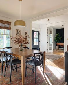 the dining room table is surrounded by chairs