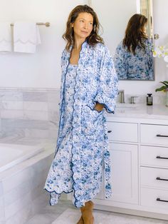 Always in style, Heidi's classic slip nightgown promises a peaceful sleep draped in super soft, lightweight cotton. The subtly feminine silhouette with flowing skirt and fitted bust offers an alluring alternative to traditional shift nightgowns, while a scalloped hem in blue adds a sophisticated finish you won't find in everyday sleepwear. Offered here in a chic floral pattern that will absolutely brighten up your at home wardrobe. This night-to-day essential brings you firmly into the now with Blue Spring Nightgown For Lounging, Spring Blue Nightgown For Bedtime, Blue Summer Nightgown For Relaxation, Casual Blue Nightgown For Relaxation, Blue V-neck Nightgown For Spring, Slip Nightgown, Floral Print Kimono, Peaceful Sleep, Blue And White Floral