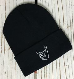 ROCK ON HAND Embroidered Beanie Cuffed Cap - Multiple Colors ✷ Cuffed Beanie with Embroidered Rock On Hand Sign ✷ Choose Color from Drop Down Menu ✷ One Size fits all ✷ 100% Acrylic ✷ Great fit and soft quality - Guaranteed! ✷ Still don't see the color combination you want? Just ask we can usually make it for you :) ✷ Shipping from Long Beach, CA ✷ Embroidered here at The One Stop Outlet ✷ If you have any questions or concerns please feel free to send us a message! ✷ Have a design idea of your o Adjustable Fit Hip Hop Hats For Winter, Hip Hop Beanie Cap One Size Fits Most, Punk Style Adjustable Beanie Hat, Adjustable Punk Beanie Hat, Adjustable Hip Hop Beanie Hat, Adjustable Punk Hat For Winter, Adjustable Punk Winter Hat, Adjustable Punk Style Winter Hat, Black Casual Unisex Hat