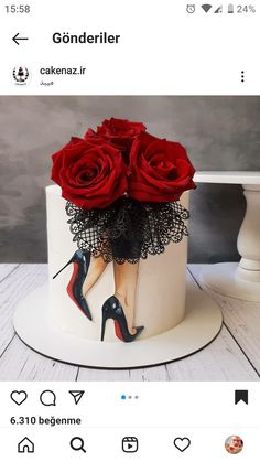 a white cake decorated with red roses and high heels