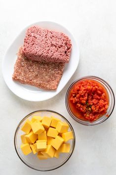 the ingredients to make this meatloaf are displayed in bowls on a white surface