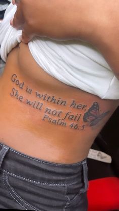 a woman with a tattoo on her stomach saying god is within her she will not fail him