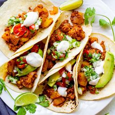 vegan chorizo potato breakfast tacos on a white plate