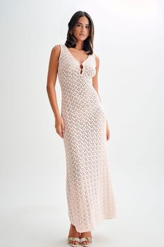 Perfect breeze Elevate your summer wardrobe with our CARTER Crochet Sleeveless Maxi Dress. Featuring a chic V neckline and a captivating front keyhole detail, this dress exudes effortless allure. Its low back adds a touch of sensuality, while the special knit fabric ensures a comfortable fit with a bodycon silhouette that flatters every curve. Unlined for a lightweight feel, this maxi-length dress is perfect for both daytime adventures and evening soirées. Flaunt your style with confidence in this timeless piece.