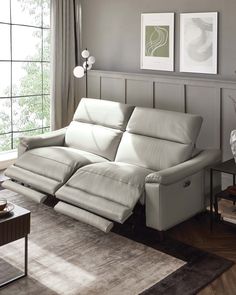 a living room scene with focus on the reclining sofa