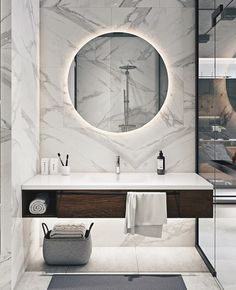 a bathroom with a sink, mirror and towel rack in it's center area