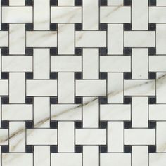 a white and black tile pattern on the floor