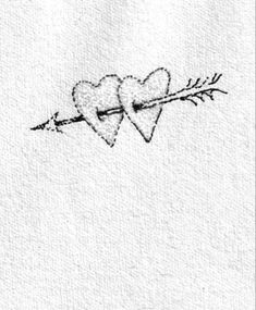 two hearts pierced in the middle with an arrow on it's side, drawn by hand