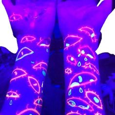 the legs and arms of a person with neon paint on them