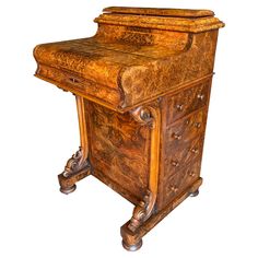 an old wooden desk with drawers and knobs on the top, is shown against a white background