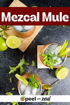 two glasses filled with ice and limes on top of a black counter next to a cutting board