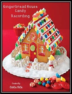 the gingerbread house candy recording book is open and ready to be used as a decoration