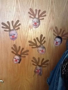 the door is decorated with reindeer's heads and noses