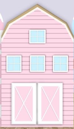 a pink barn with two doors and windows