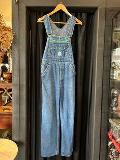 1990's Liberty denim overalls  Made in USA 100% Cotton Size - XS/S Measurements:- Waist - 28" or 71cm Button to button - 26" or 66cm Hip - 34"-36" Outer Leg (from waist) - 39" or 99cm Inner leg - 28" or 71cm Best fit size 6-8 Vintage Denim Blue Bib Front Overalls, Vintage Dark Wash Bib Front Overalls, Retro Dark Wash Denim Jumpsuit, Vintage Cotton Denim Jumpsuit With Button Closure, Retro Dark Wash Bib Front Overalls, Retro Bib Front Overalls In Medium Wash, Vintage Bib Front Denim Jumpsuit In Medium Wash, Retro Denim Bib Front Jumpsuit, Vintage Denim Blue Bib Front Jeans