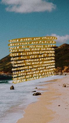 an image of a beach with words written in the sand and on the water above it