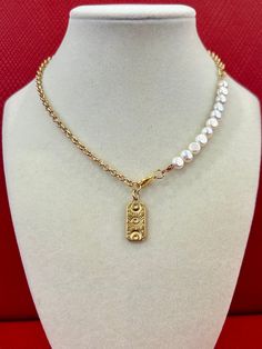 This stylish and elegant necklace effortlessly blends the timeless allure of pearls with the sleek sophistication of a gold chain. The addition of a rectangular evil eye pendant adds a unique, eye-catching element that elevates its charm. Perfect for both everyday wear and special occasions, this necklace is a versatile accessory that enhances any fashionable outfit. **Description** * Rolo Chain: 14K gold plated on brass * Freshwater pearls, 6~7mm, button shaped * Evil eye pendant, 10x22mm, 14K Gold Plated Chain Pearl Necklace As Gift, Outfit Description, Gift For Mom Christmas, Turquoise Pendant Necklace, Mom Christmas, Elegant Necklace, Eye Pendant, Evil Eye Pendant, Necklace Boho