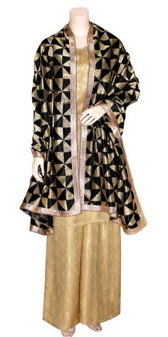 This stunning party wear 3-piece suit includes a golden shimmer silk long full sleeves kurti & palazzo pants along with a Baag Phulkari dupatta. The dupatta is designed in traditional hand embroidered Punjabi phulkari work. The pants come with a comfortable elastic waist band. A fashionable outfit for a special occasion! Fabric: Shimmer Silk Kurti & Palazzo with Taffeta lining Stitching: Fully Stitched Care: Dry clean recommended Message: Please feel free to contact us to customize this outfit or any other queries. Note: Product color may slightly differ from the image. Please note the we offer expediate shipping, that only speeds up the shipping time, our processing time will not be effected. Semi-stitched Banarasi Silk Sharara With Dabka Work, Semi-stitched Bollywood Salwar Kameez With Zari Work, Semi-stitched Gold Banarasi Silk Traditional Wear, Chinon Traditional Wear With Long Sleeves For Diwali, Festive Long Sleeve Chinon Sharara, Semi-stitched Chanderi Sharara With Dabka, Long Sleeve Chinon Salwar Kameez For Diwali, Fitted Chinon Traditional Wear With Long Sleeves, Long Sleeve Traditional Wear With Zari Work In Chinon