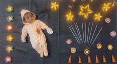 a baby doll laying on top of a table next to some lights and decorations that look like stars