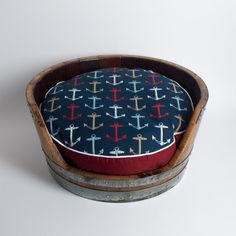 a dog bed with an anchor pattern on it