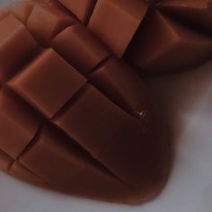 two pieces of chocolate sitting on top of each other