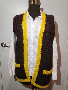 Retro 1970s Crochet Brown and Yellow Vest With Pockets A very popular color from the greatest decade, the 1970s! Brown and Yellow yarn used to create this retro Crochet vest which is perfect for fall weather and winter weather. A nostalgic piece of vintage fashion! Everyone was wearing Crochet vest back in the day!  The vest measures: Breast 38"  Waist 38" Hips 40" Length 30"  A very Nicely Done Crochet hippie mod style vest. Some pilling but really a nice vintage Crochet 70s vest to keep you wa Crochet 70s, 70s Vest, 1970s Crochet, Crochet Brown, Retro Crochet, Yellow Yarn, Vest With Pockets, Yellow Vest, 1970's Fashion