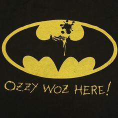 the batman logo is painted on a black t - shirt that says, ozzy woz here