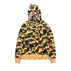 Find BAPE 1st Camo Shark Full Zip Hoodie on Editorialist. Rendered in an allover camouflage print, the BAPE 1st CAMO Shark Full Zip Hoodie 'Yellow' from SS20 features the brand's iconic shark-face motif on the hood and a full-extension zip. Yellow Zip Up Hoodie, Yellow Camo, Bape Hoodie, Sweater Plus Size, Camouflage Design, Full Zip Hoodie, Zip Hoodie, Camouflage, Camo