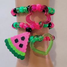 These kandi bracelets are made with glitter pink,green and black pony beads and cute charms. These are made in all different sizes. One size fits most. Perfect for any event! You will get lots of compliments in this unique wearable art! Stand out at your next event! Edm festival  Raves Party  Rave outfit  Festival outfit Pride Party favors  Birthday gifts Stocking stuffer  Rave anniversary  Rave gift Watermelon Bracelet, Bracelets Kandi, Pride Party, Rave Outfits Festivals, Hippie Bracelet, Diy Kandi Bracelets, Kandi Perler, Diy Kandi, Party Favors Birthday