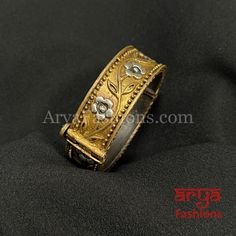 Dual Tone Golden Silver Rajwadi Openable Bracelet- Dual Tone Oxidized Silver Bracelet- Very Elegant and stylish, this bracelet can be paired with any Attire depending upon the occasion and the theme.- The base is pure brass (90%) and pure 92.5 silver (10%) which makes this very sturdy and of good quality.- 100% guarantee on the polish- it will not lose its finish/color/shine.- Very lightweight and Hand carved. - Available in size 2.4 and 2.6. - Openable Bracelet with screw closing feature Adjustable Ceremonial Bangle Bracelets, Adjustable Bangle Bracelets For Ceremonial Occasions, Traditional Band Jewelry As Gift, Adjustable Ceremonial Gold Bangle Bracelet, Traditional Bangle Wristband As Gift, Traditional Adjustable Gold Bracelet For Gift, Traditional Adjustable Gold Bracelet As A Gift, Traditional Adjustable Gold Bracelet Gift, Oxidized Bangles