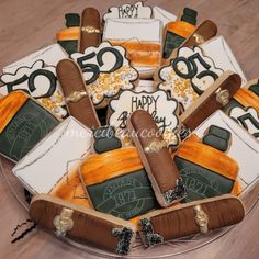 a birthday cake decorated with cigars and numbers